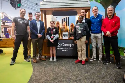 Canopy Team Members with JA BizTown Student at a Canopy Kisok in JA BizTown